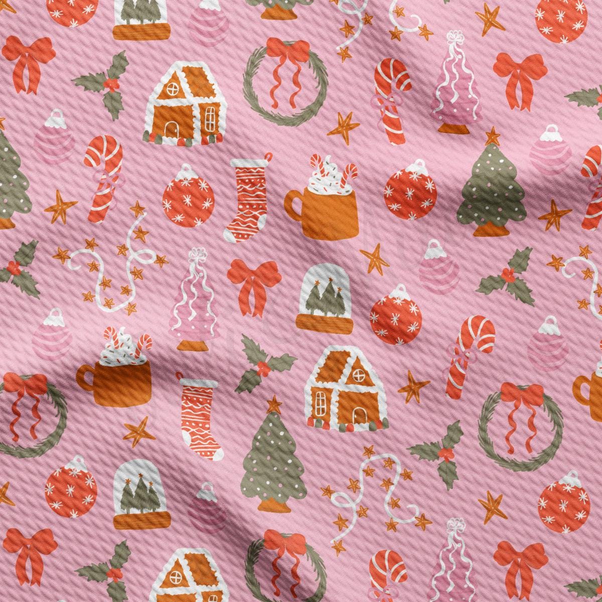 a pink background with a pattern of christmas decorations