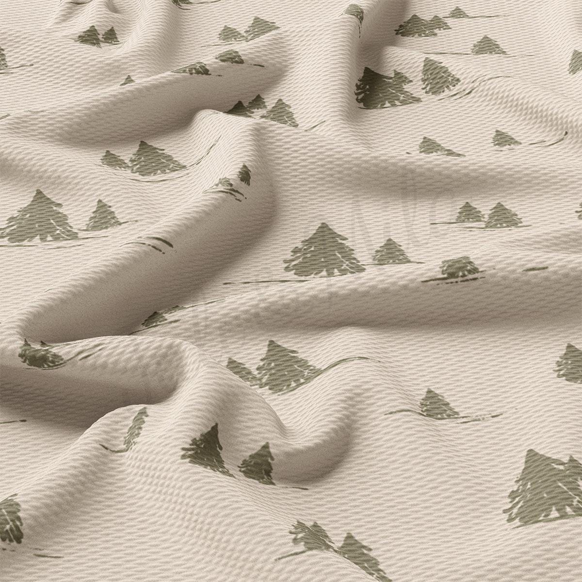 a close up of a sheet with a pattern of trees on it