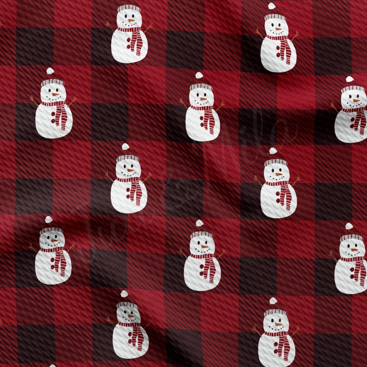 a red and black plaid pattern with snowmen on it