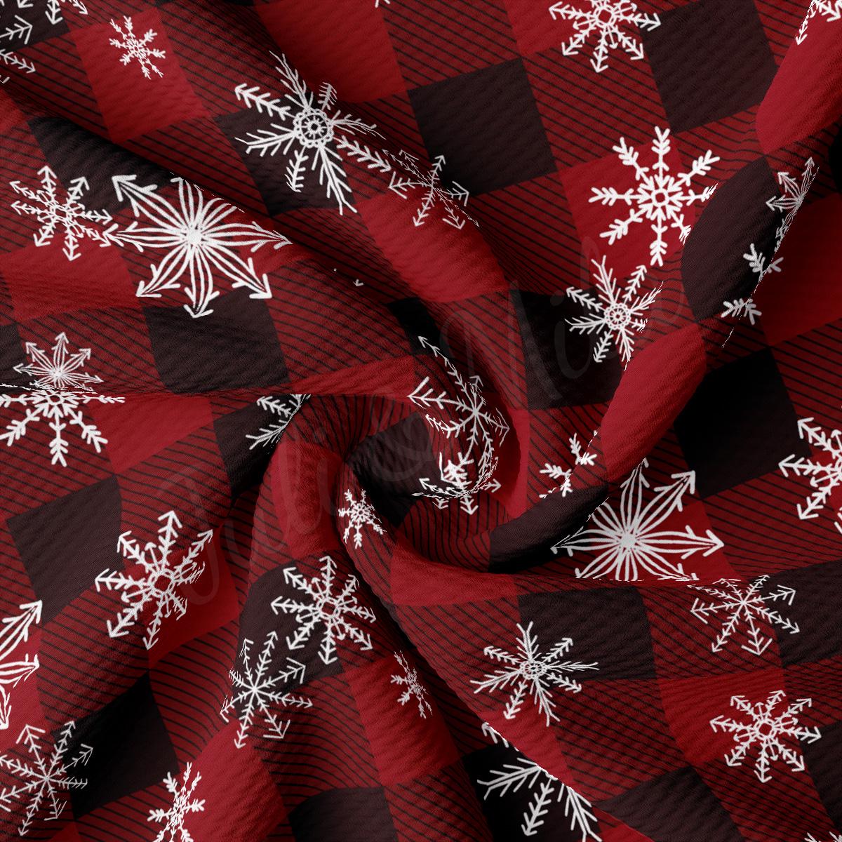 a red and black checkered fabric with white snowflakes