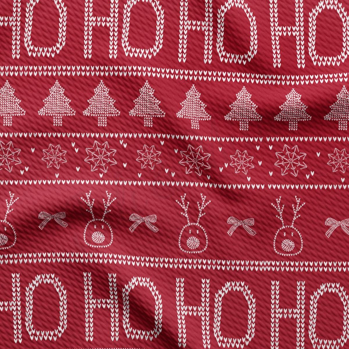 a red sweater with a pattern of christmas trees and snowflakes