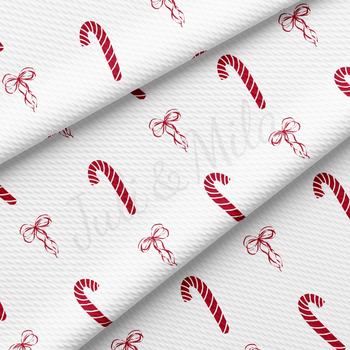 a white background with red candy canes on it