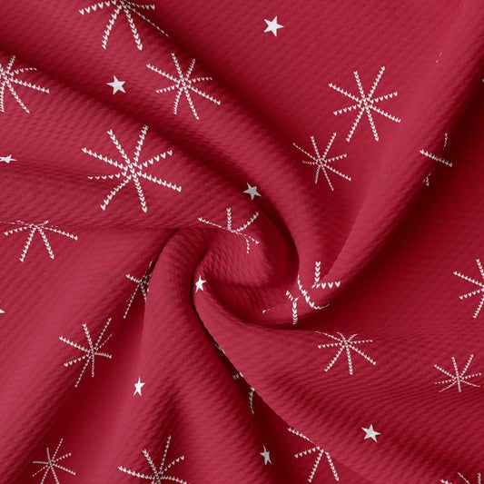 a red fabric with white stars on it