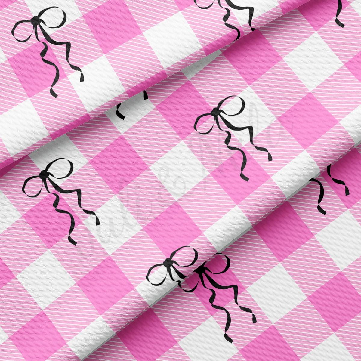 a pink and white checkered table cloth with black stick figures on it