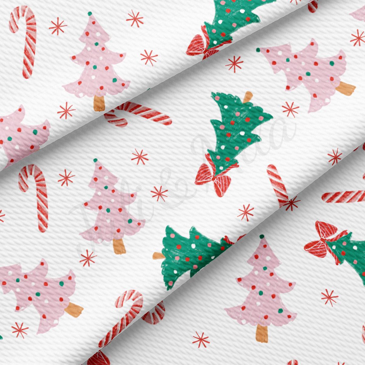 a white background with christmas trees and candy canes