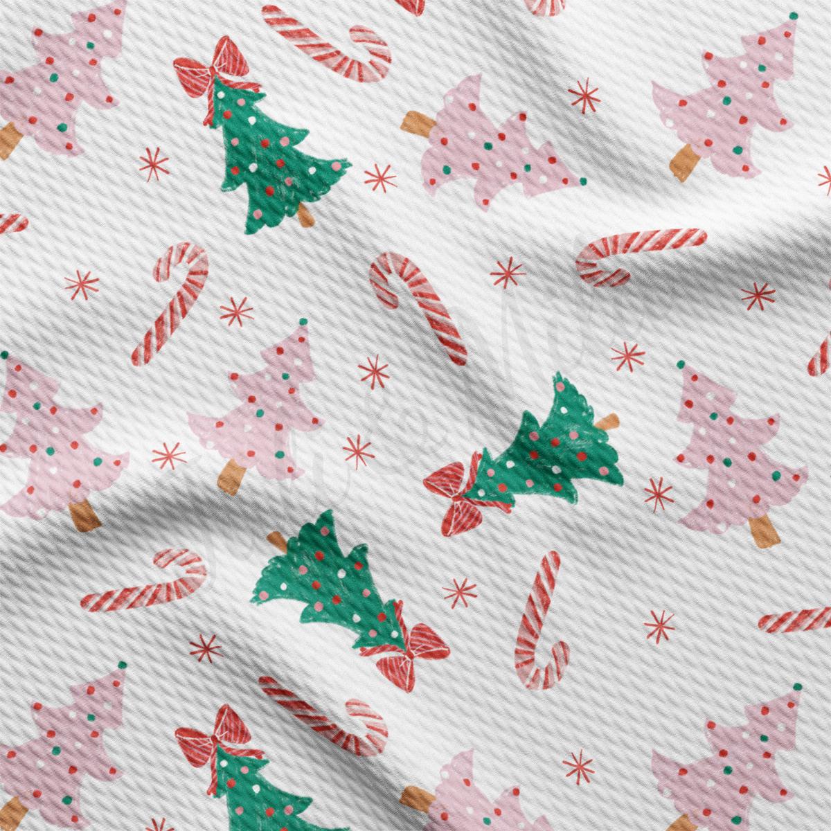 a white background with christmas trees and candy canes