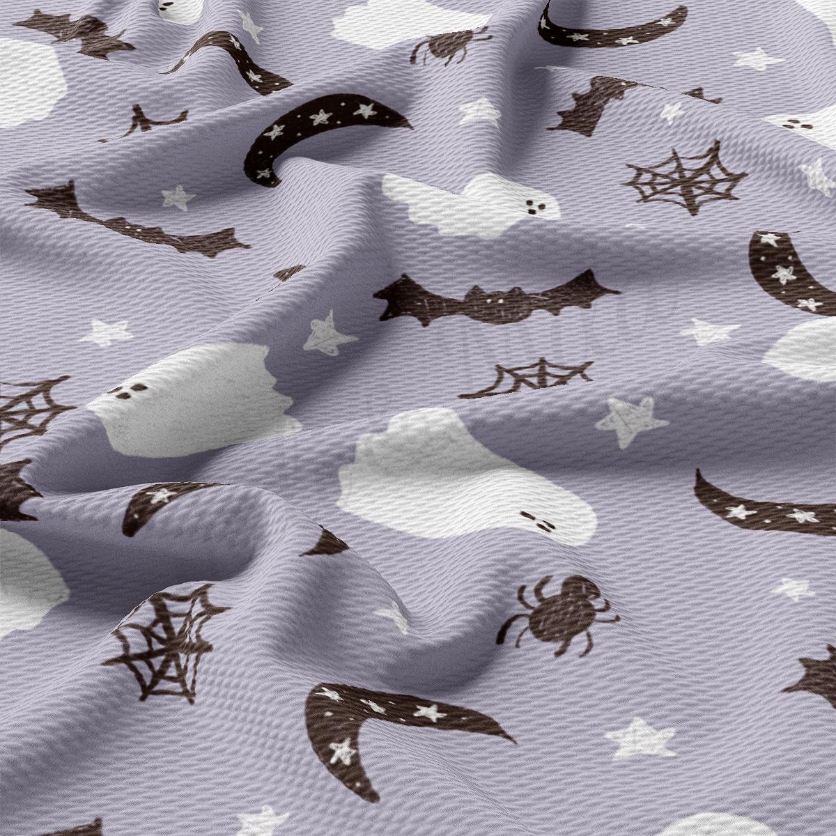 a close up of a purple fabric with white stars and bats