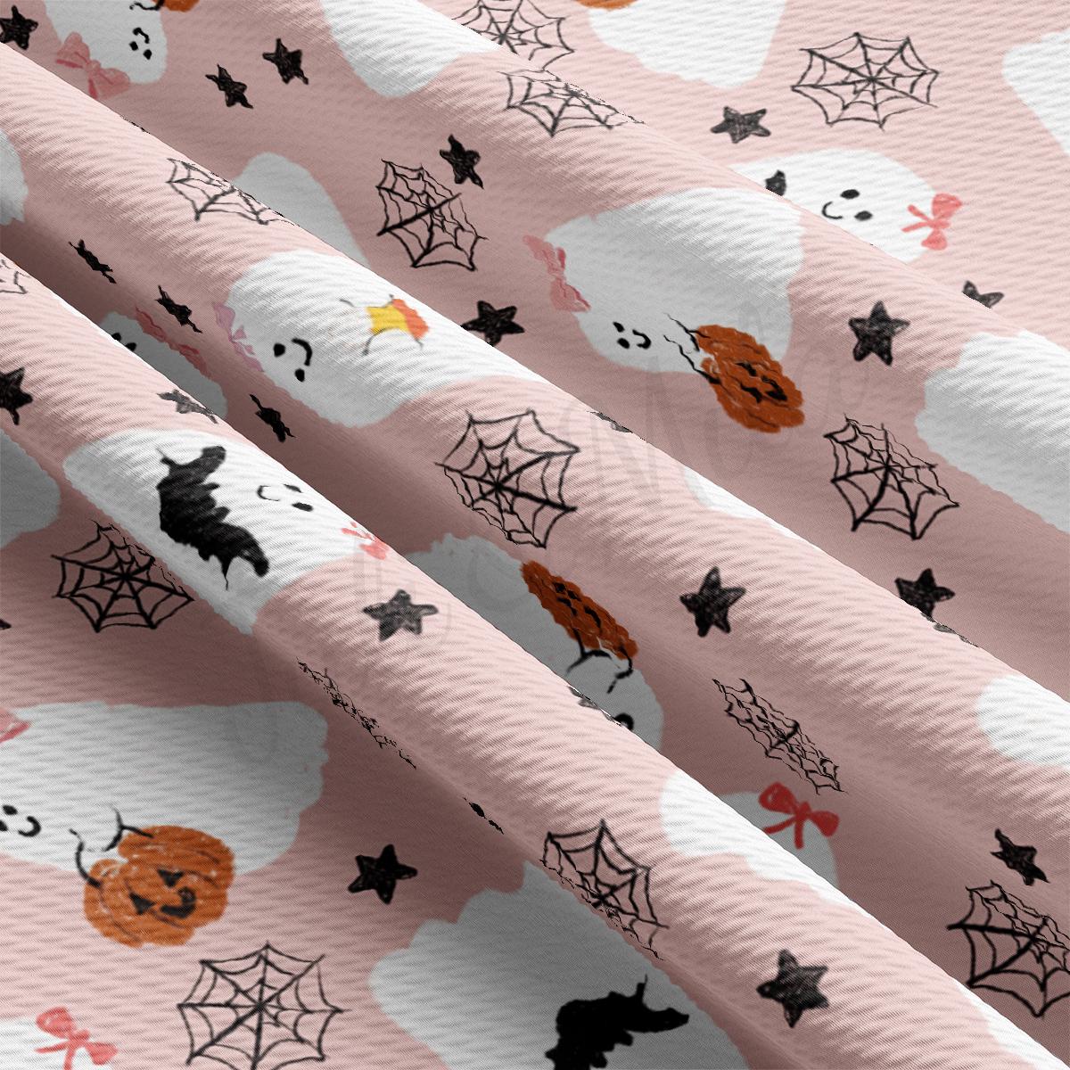 a pink background with a pattern of halloween pumpkins and bats