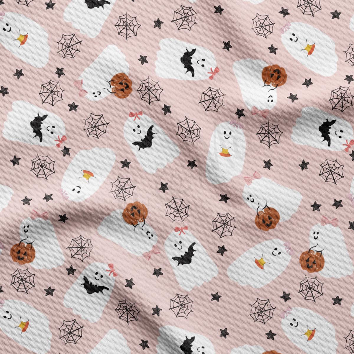 a pattern of halloween ghostes and stars on a pink background