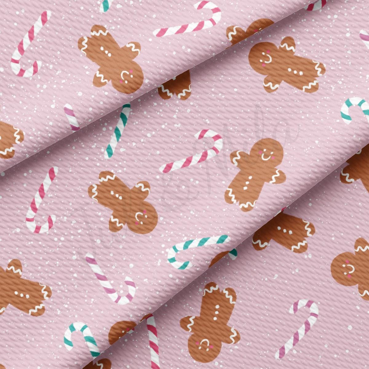 a pink background with gingerbreads and candy canes