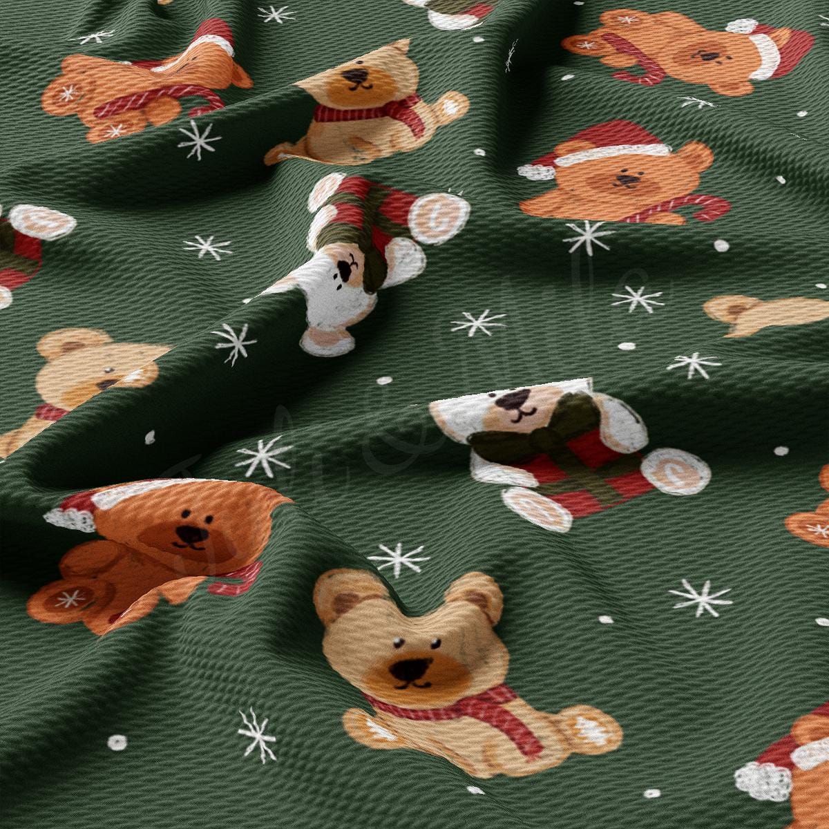 a green fabric with teddy bears and snowflakes