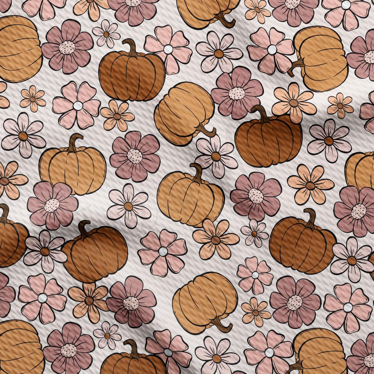 a pattern of pumpkins and flowers on a white background