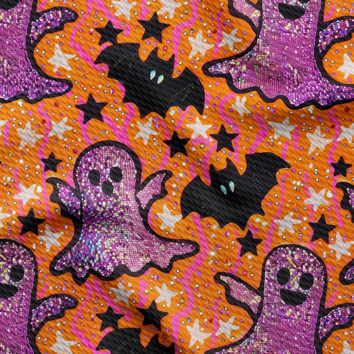 a purple and orange halloween fabric with ghostes and stars