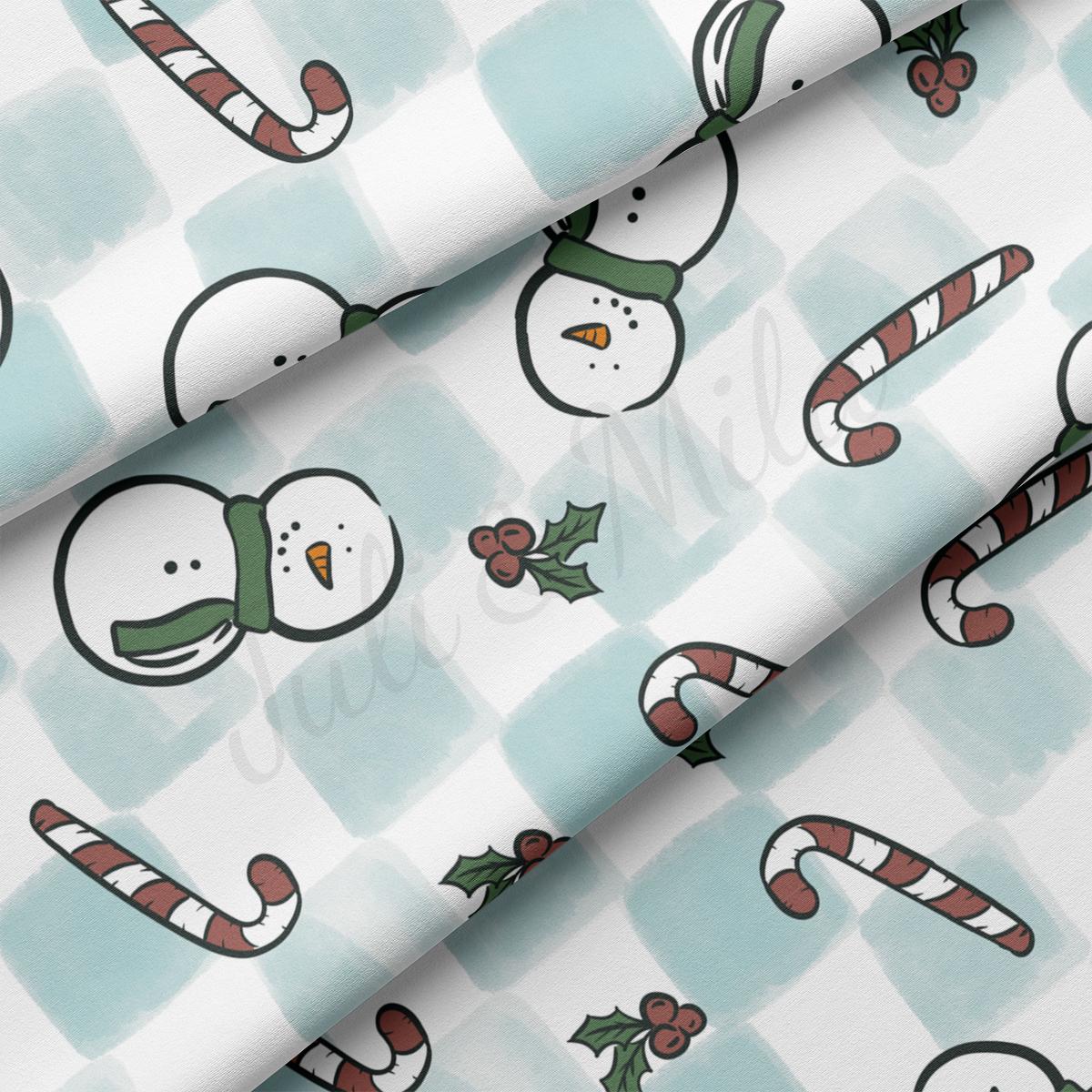 a pattern of a snowman and candy canes