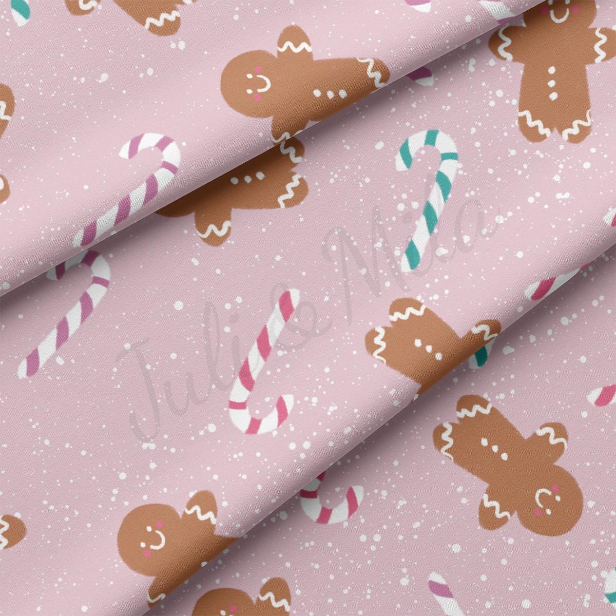 a pink background with gingerbreads and candy canes