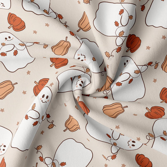 a close up of a white fabric with a pattern of pumpkins and ghost