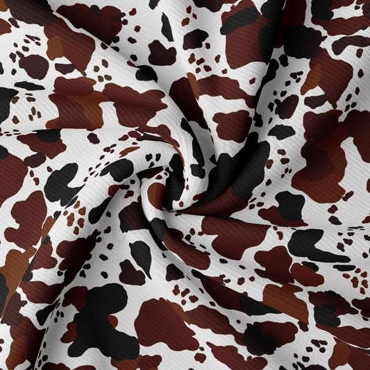 a brown and white camouflage print fabric