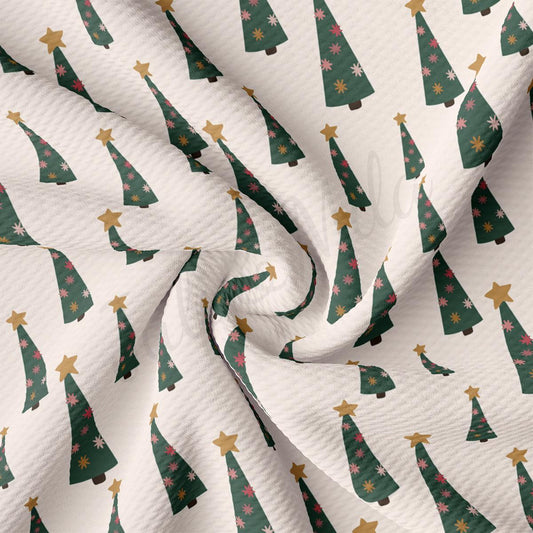 a white background with green and gold christmas trees