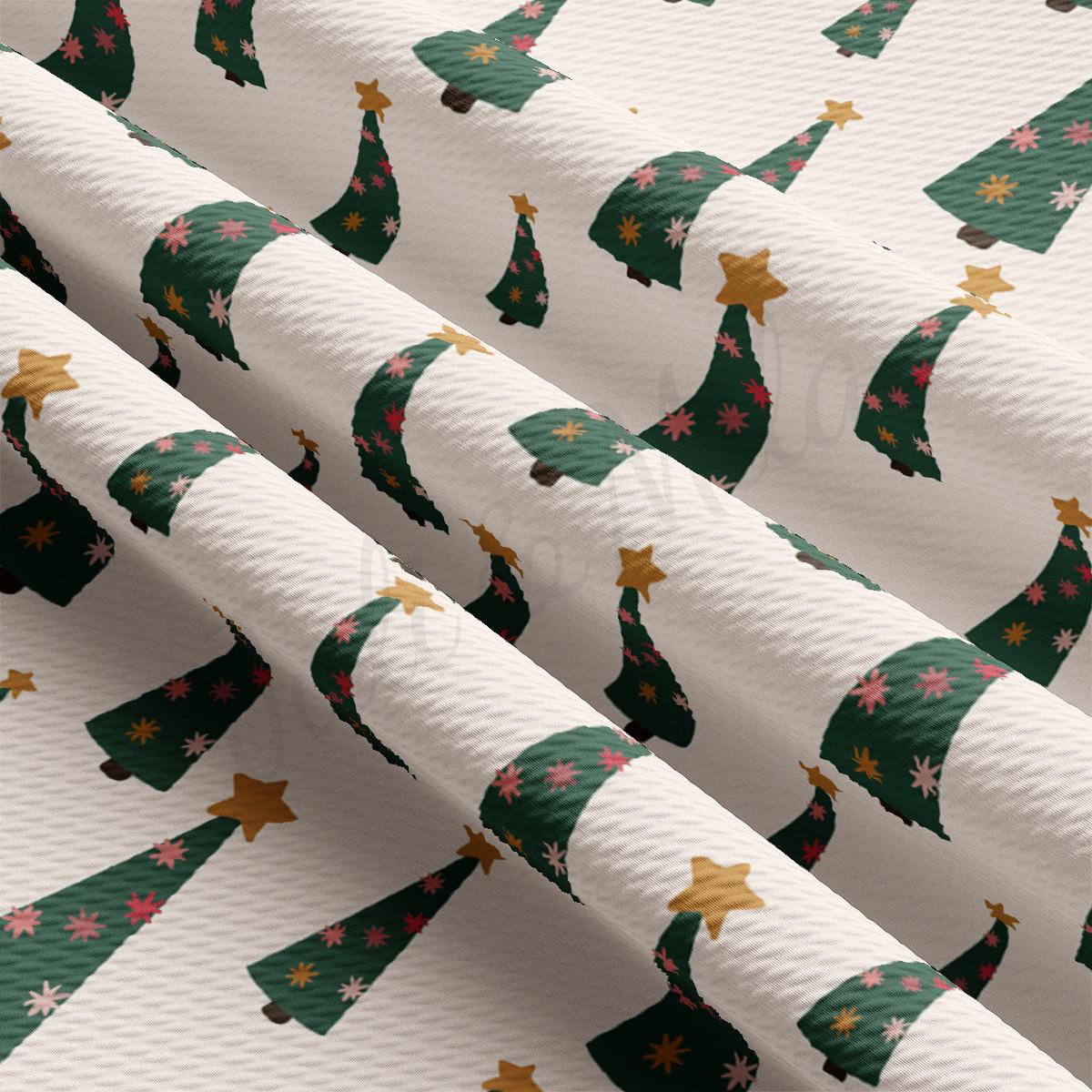 a close up of a wrapping paper with christmas trees on it