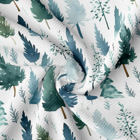 a white fabric with green leaves on it