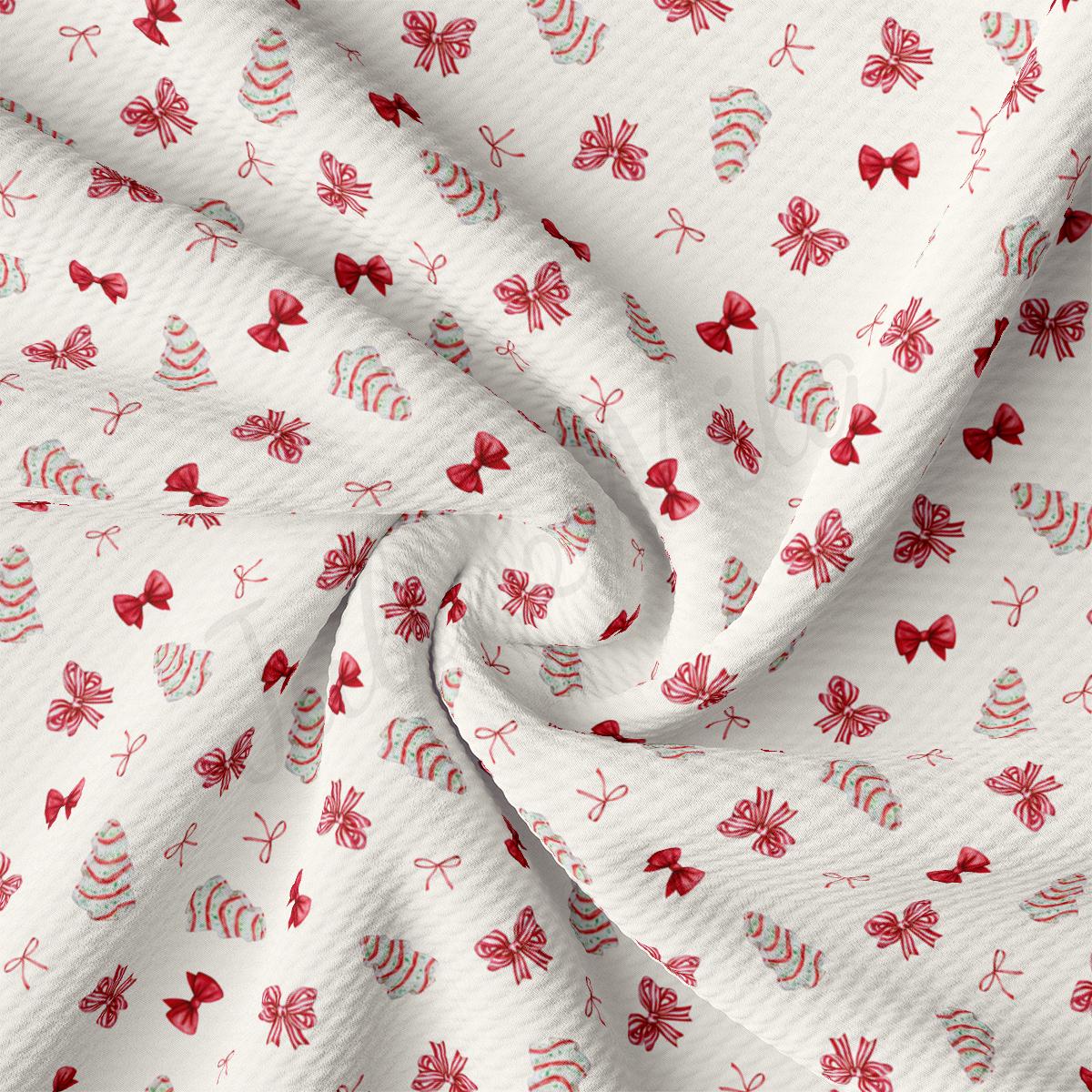 a close up of a white fabric with red flowers on it