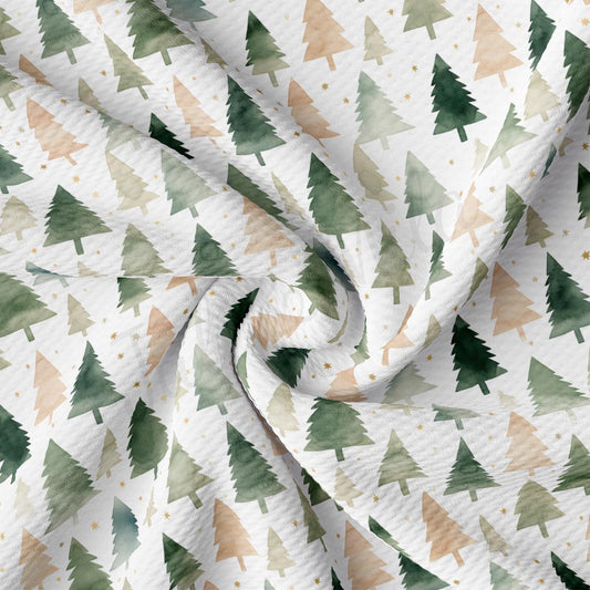a close up of a white fabric with trees on it