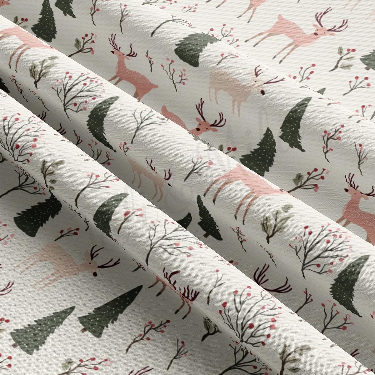 a pattern of deer and trees on a white background