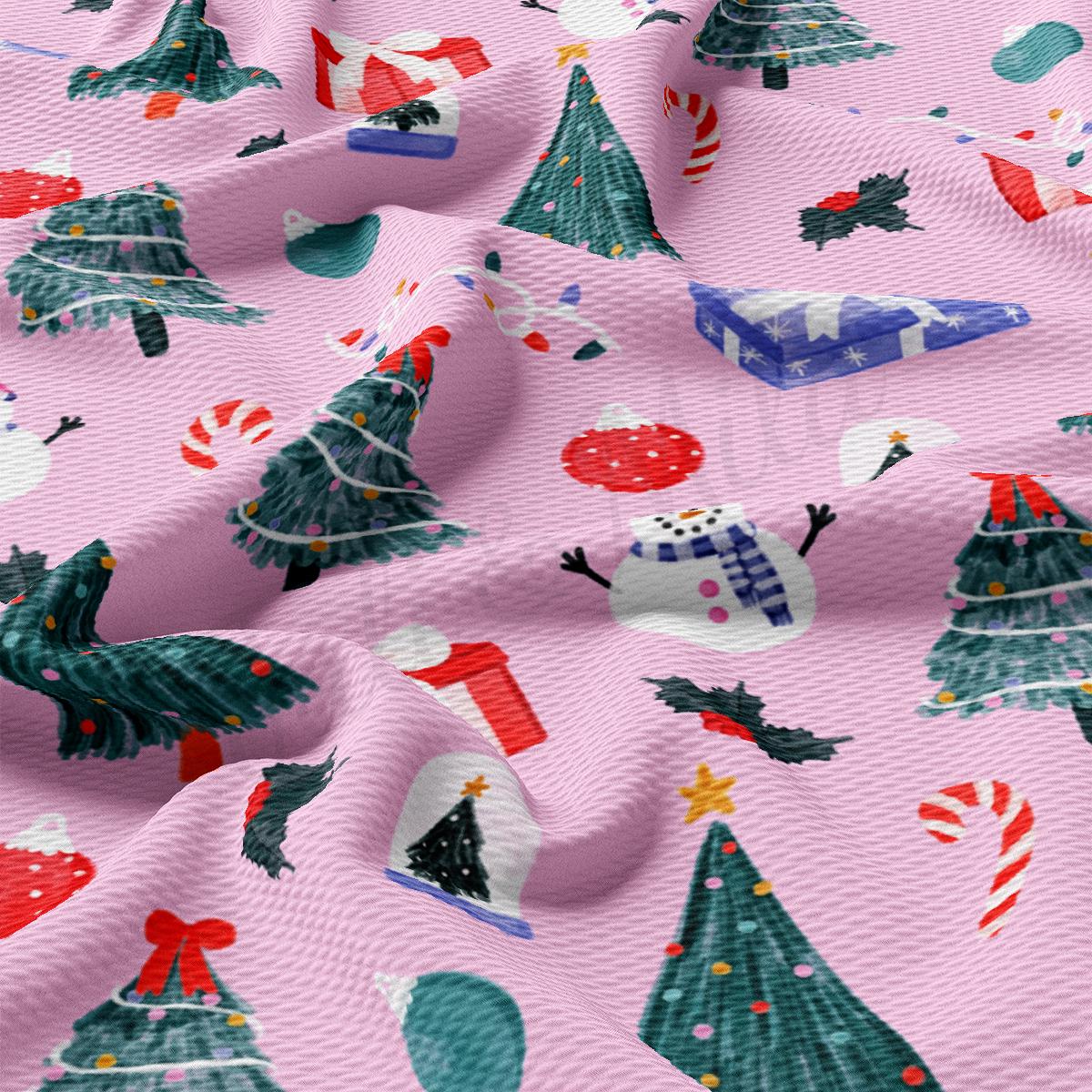 a pink fabric with christmas trees on it