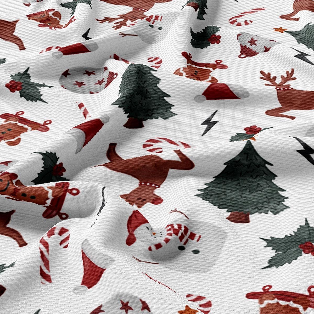 a white fabric with red and green christmas decorations