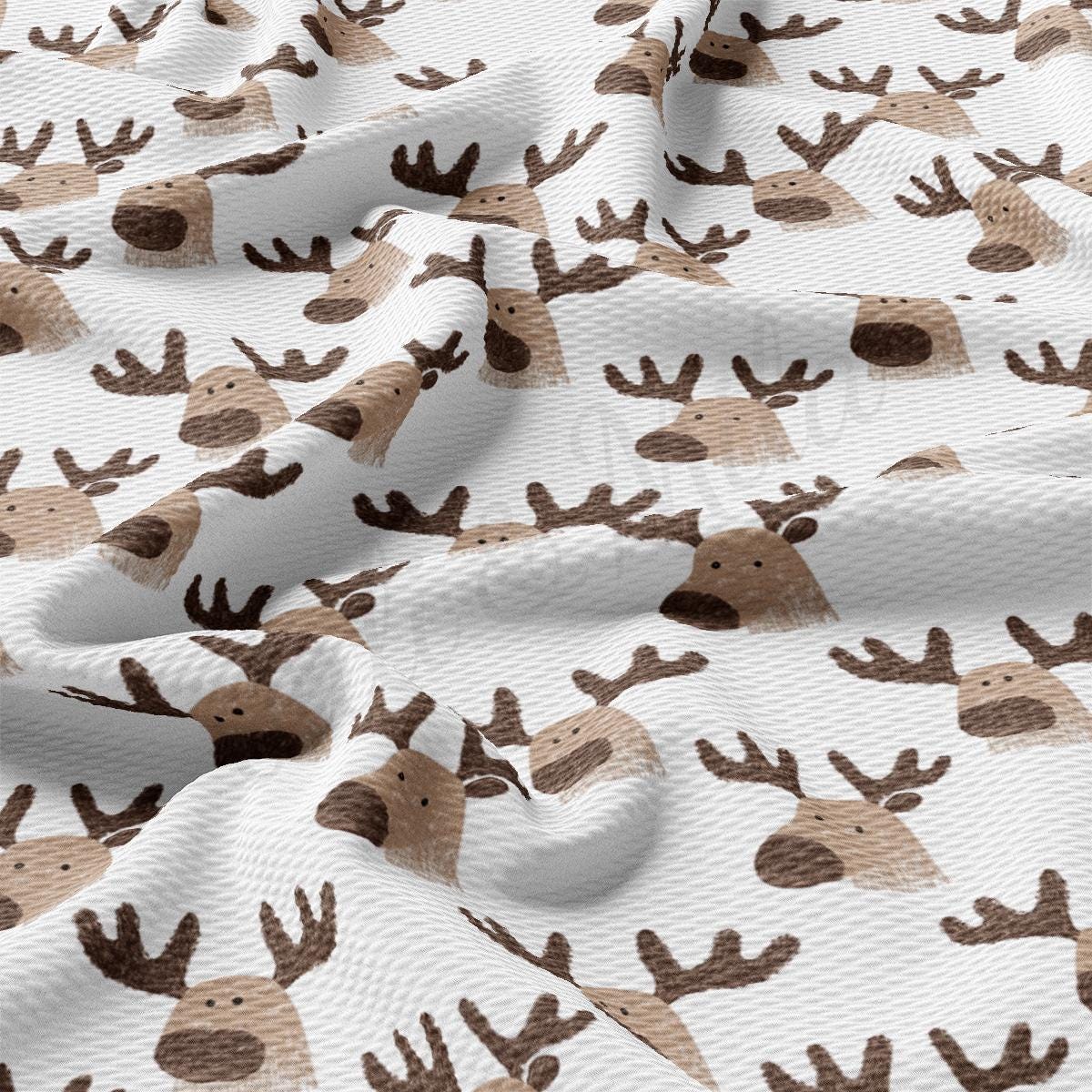 a close up of a pattern of deer on a white background