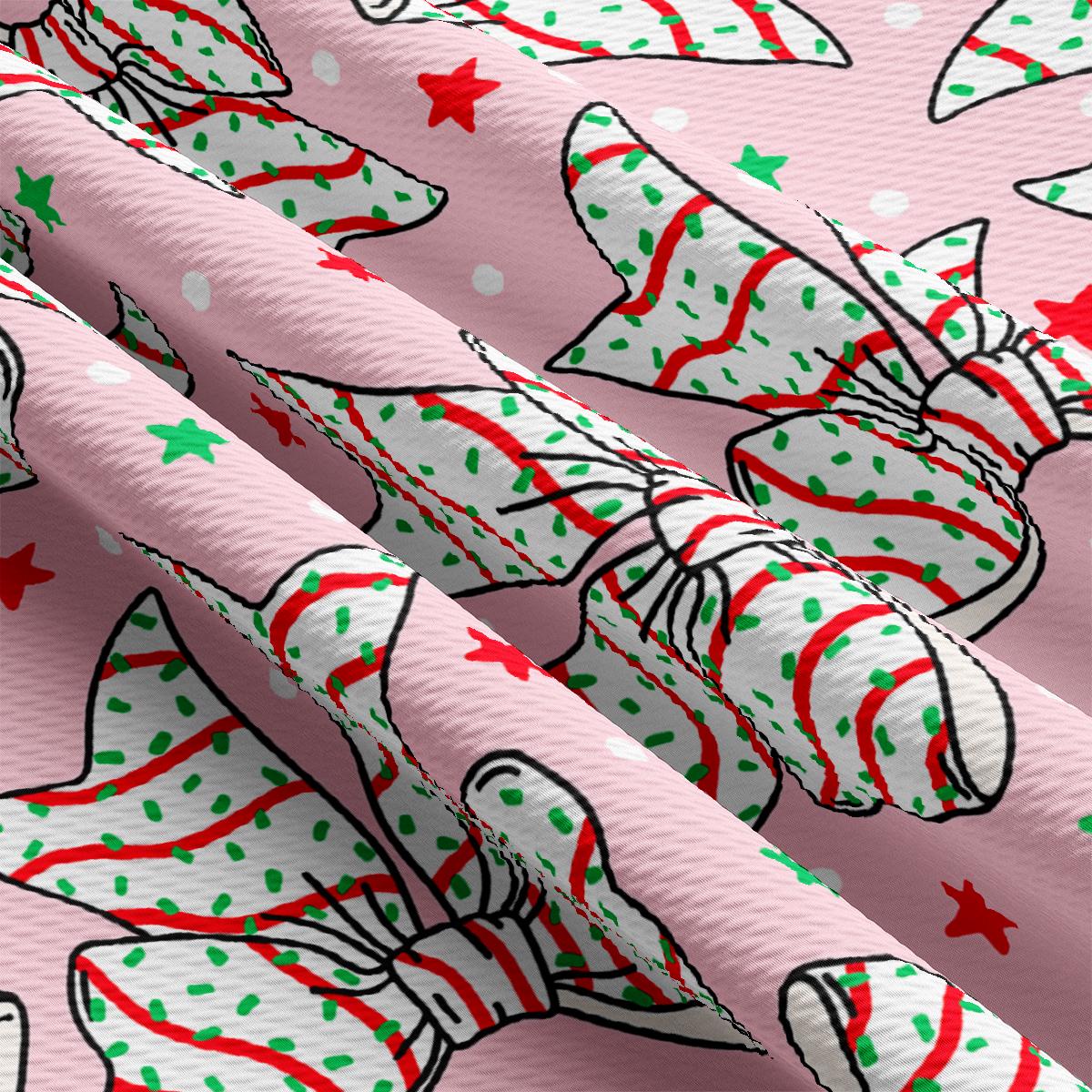 a pink wrapping paper with a christmas pattern on it