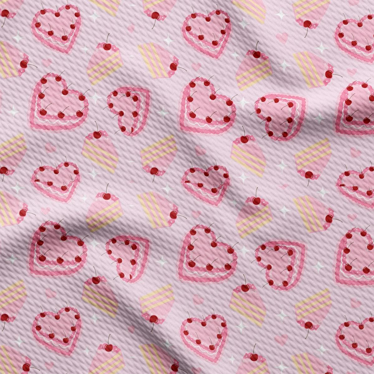 a pink fabric with hearts on it