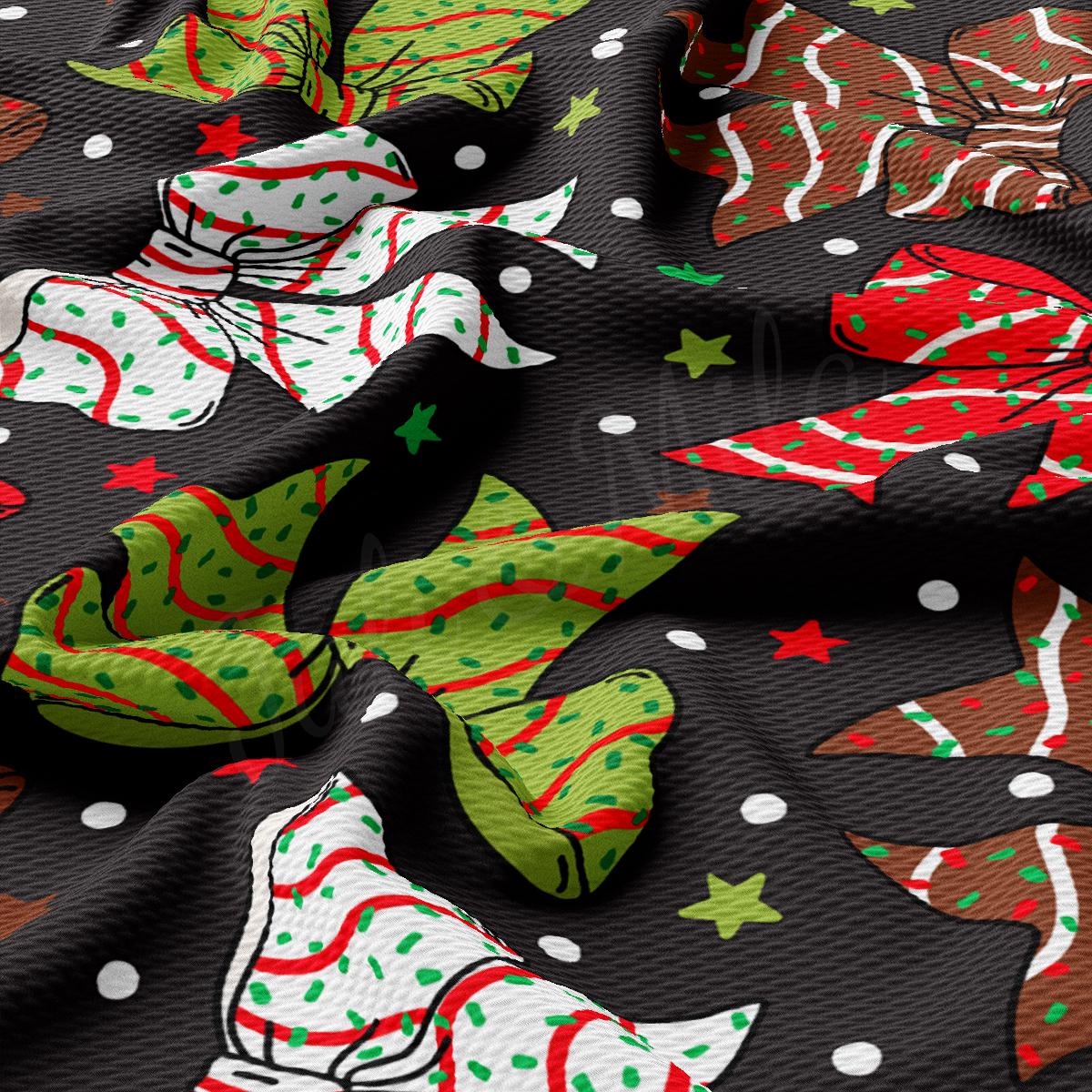 a close up of a black fabric with christmas decorations on it