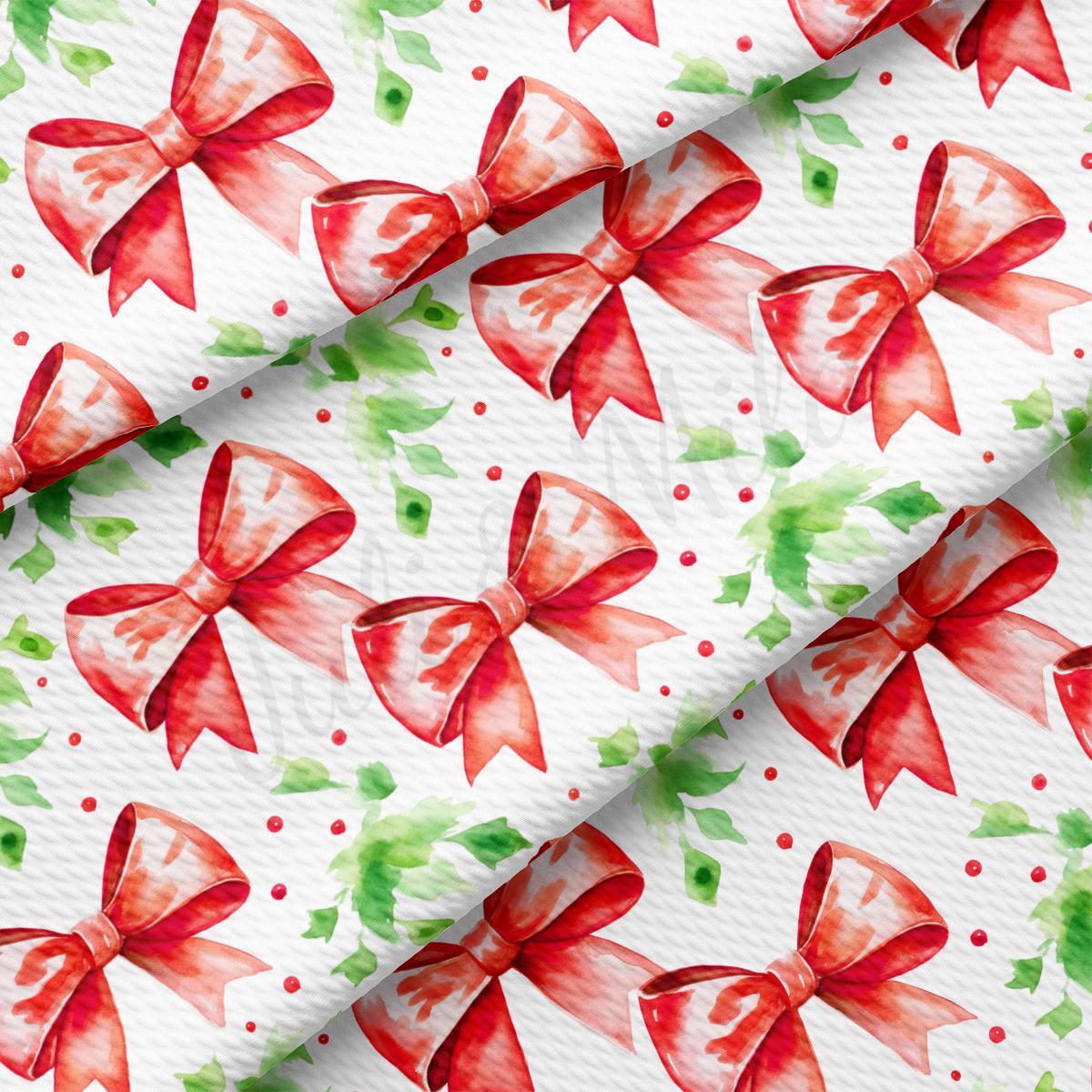 a red and green bow on a white background