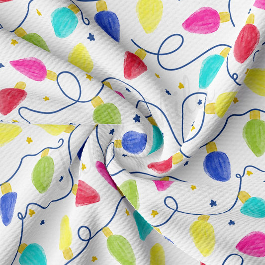 a white fabric with colorful balloons on it