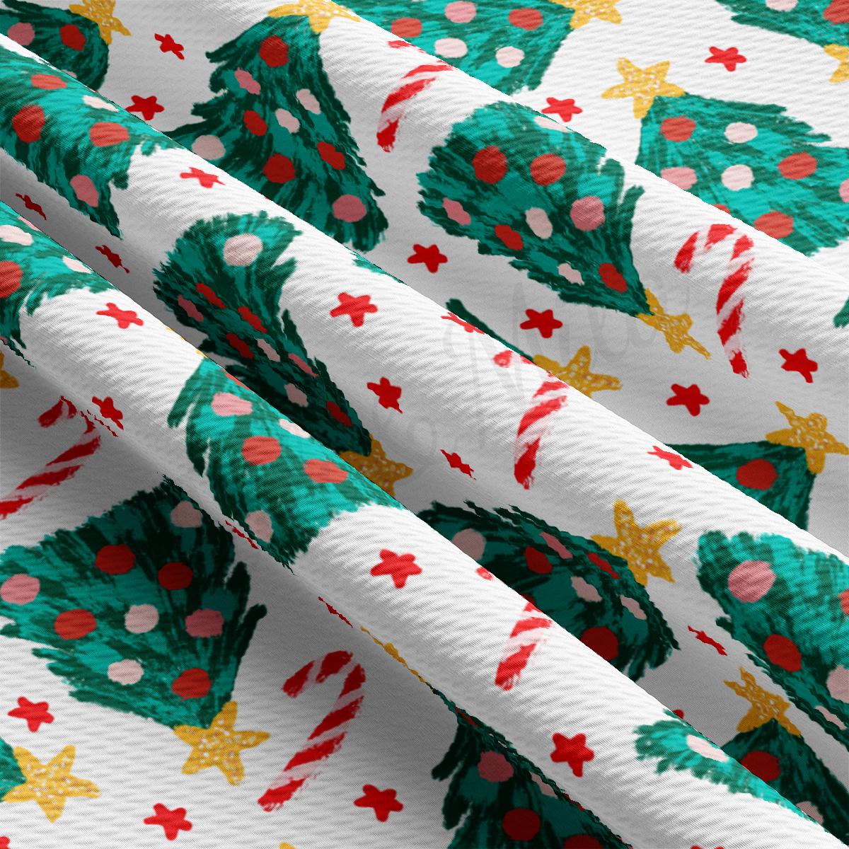 a close up of a wrapping paper with a christmas tree on it