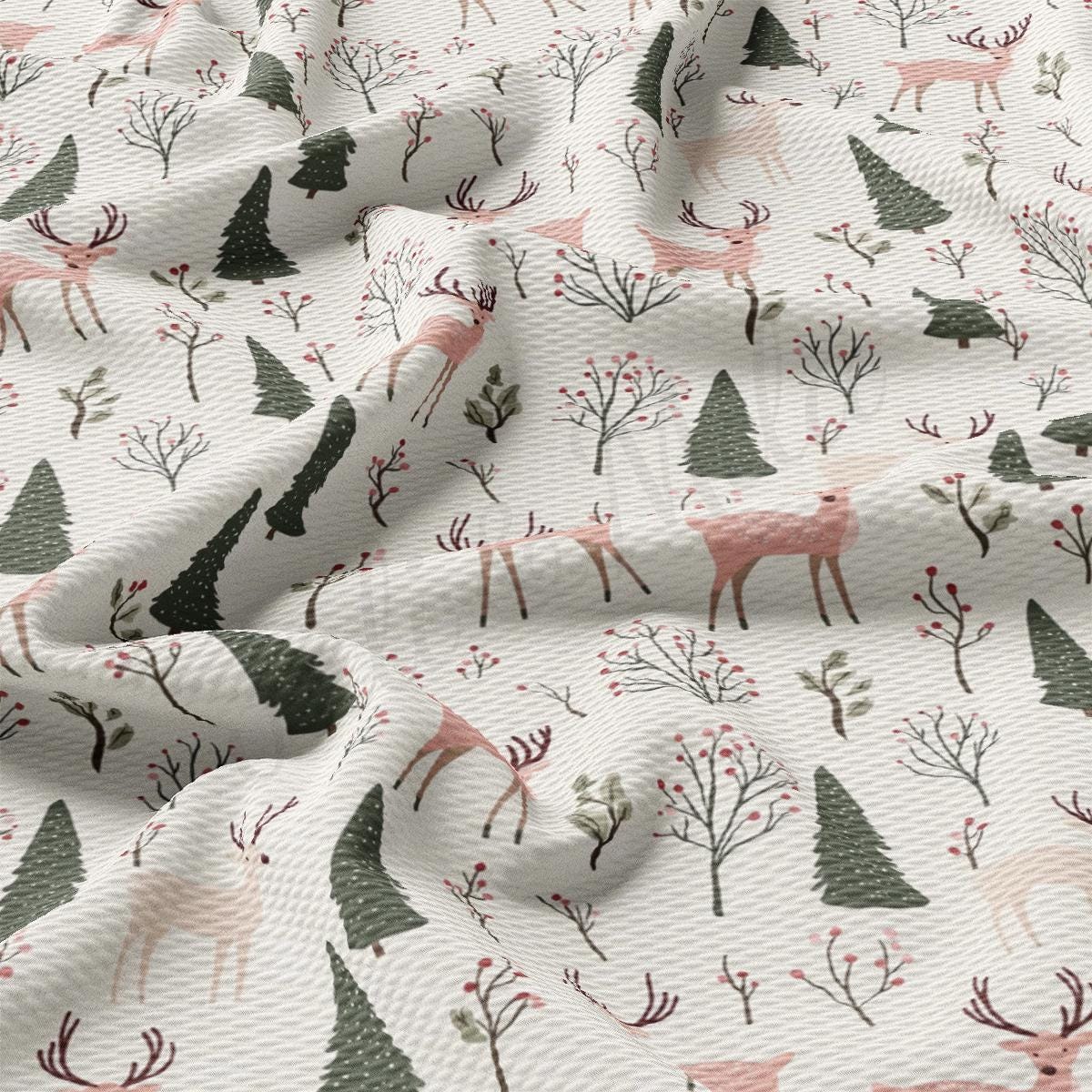 a white fabric with trees and deers on it