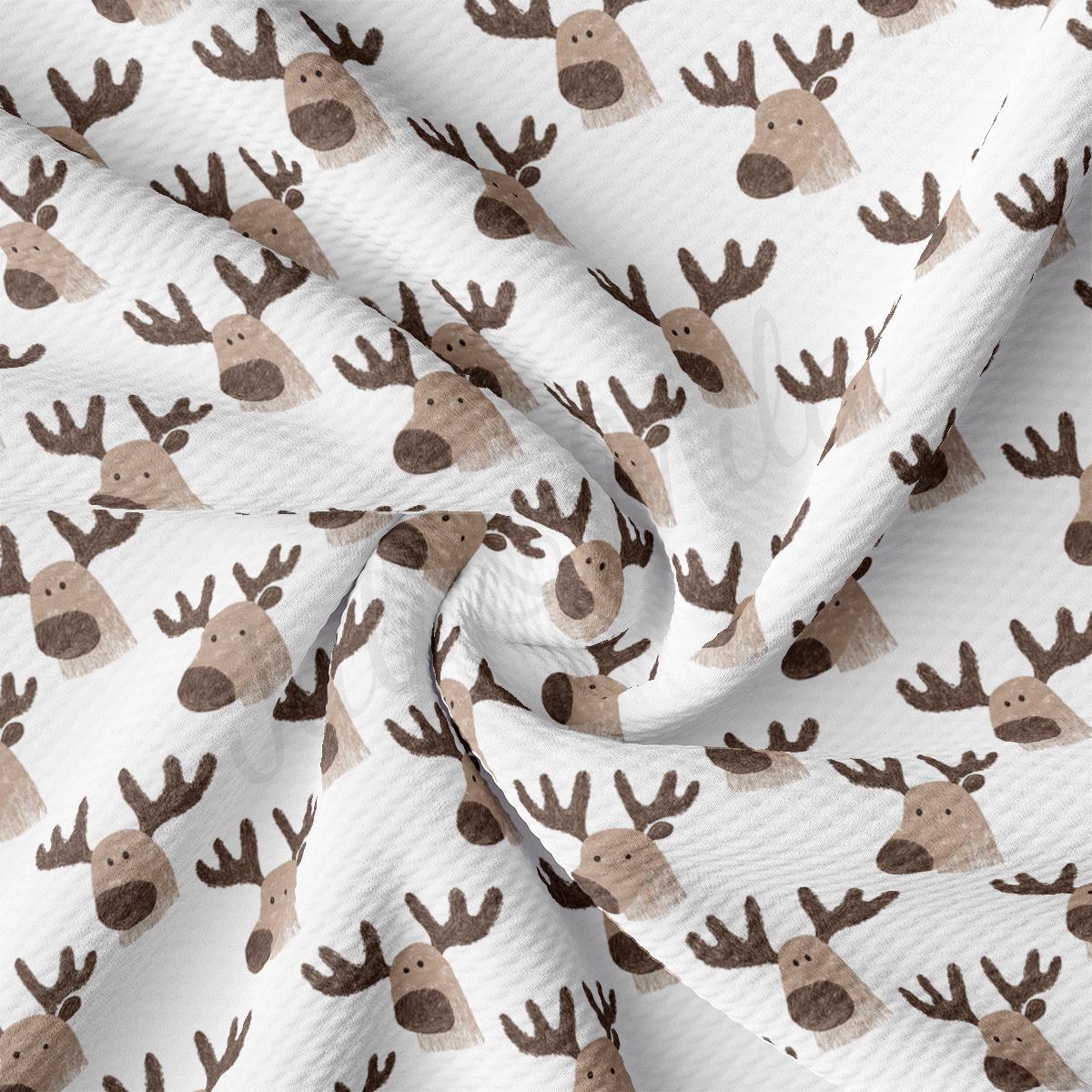 a close up of a white and brown reindeer print fabric