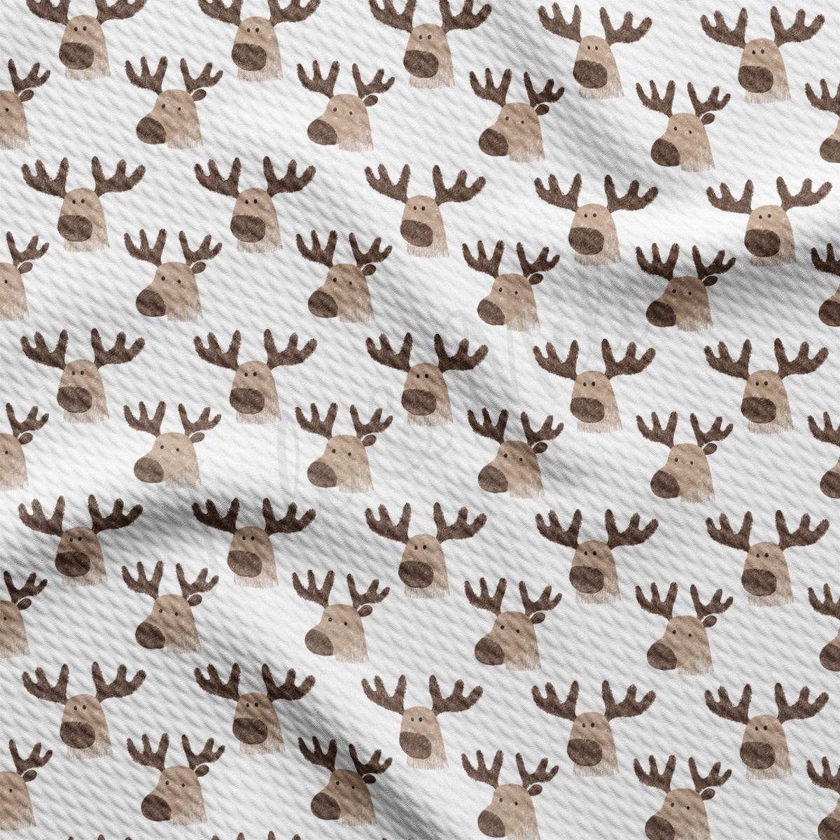 a pattern of deer heads on a white background